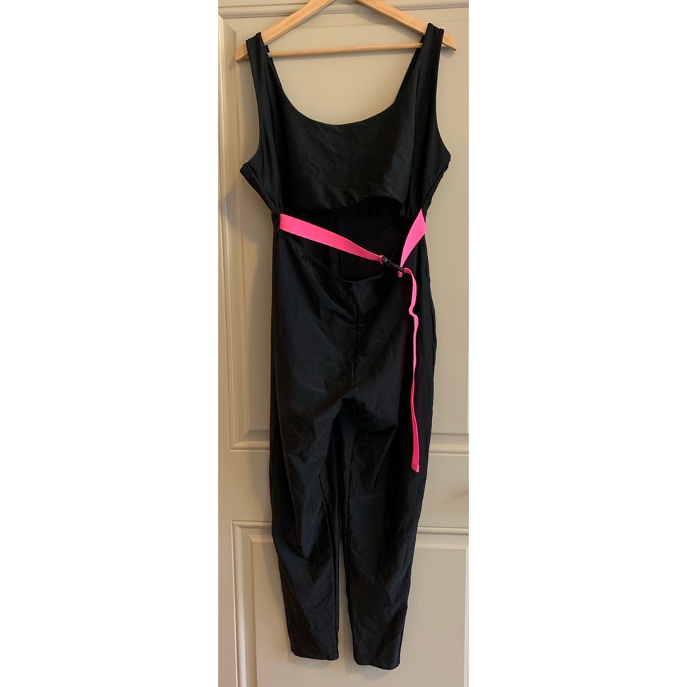 - black jump suit with pink belt